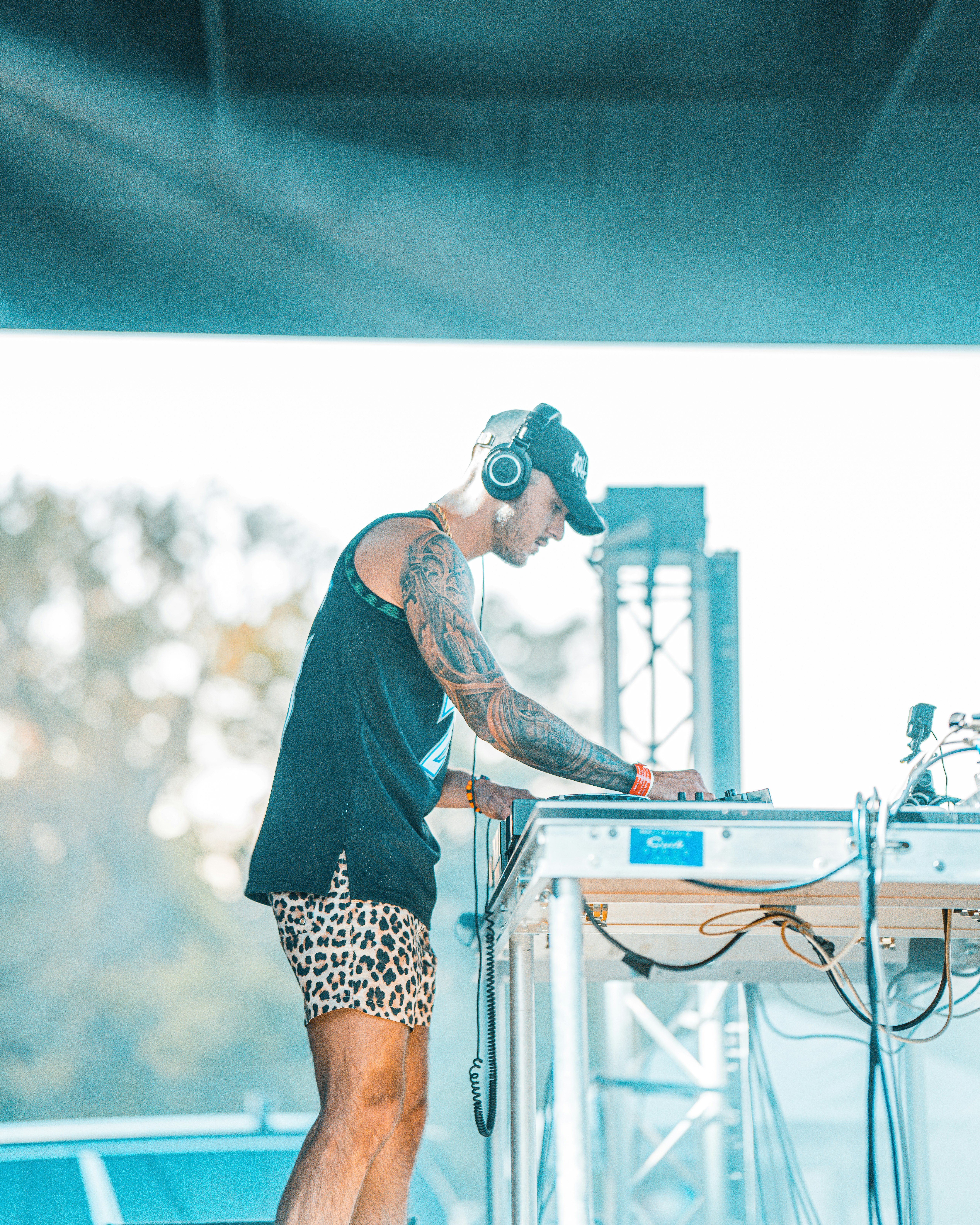 woman in black long sleeve shirt and black and white skirt wearing blue goggles